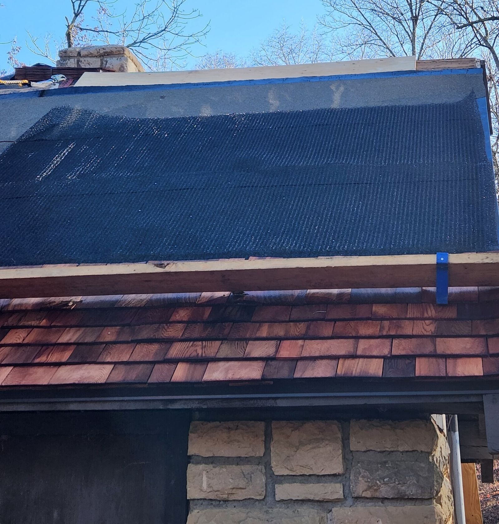 Roofer working on a steep pitched roof